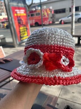 Red and White Crochet Bucket Hat with Floral Accent